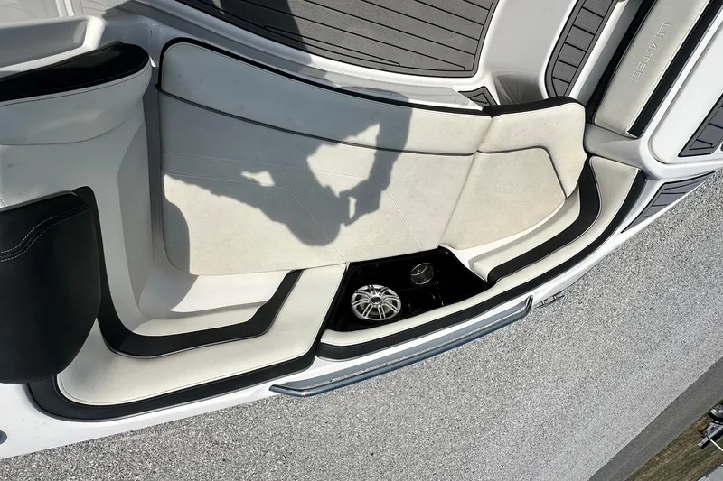 Slide: The Image of 2016 Yamaha 242 Limited S boat interior with seating and speaker detail. - 23