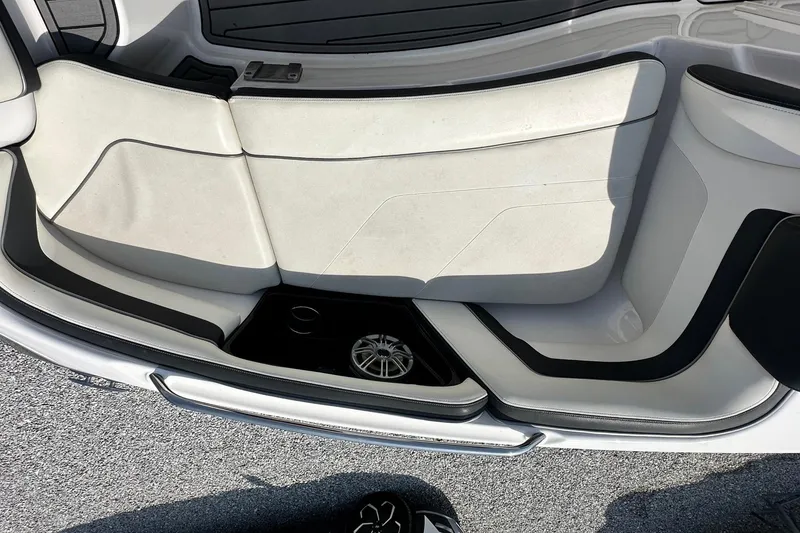 Slide: The Image of Interior seating of 2016 Yamaha 242 Limited S boat, featuring sleek white and black design. - 26