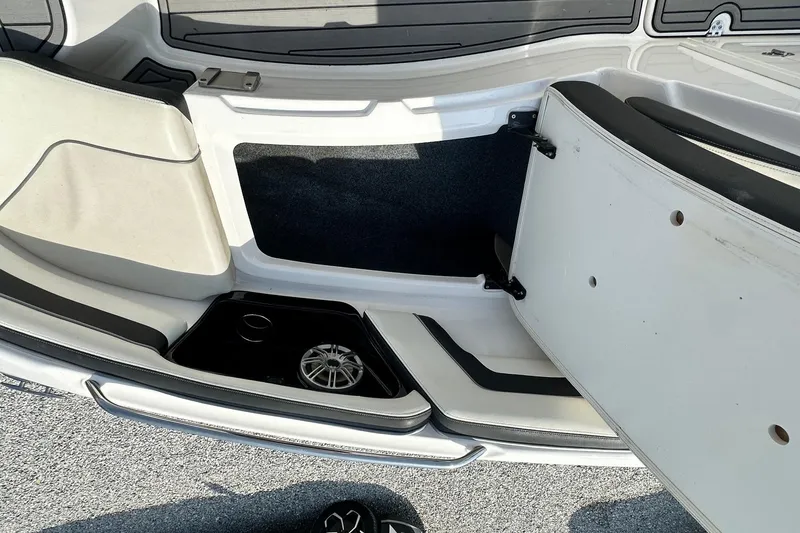 Slide: The Image of Interior view of a 2016 Yamaha 242 Limited S boat, showcasing seating and storage area. - 30