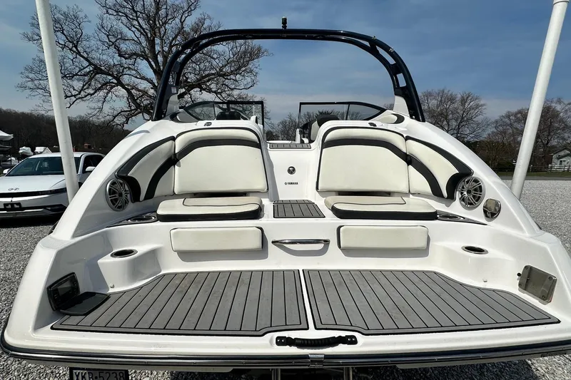 Slide: The Image of 2016 Yamaha 242 Limited S boat with sleek seating and modern design. - 4