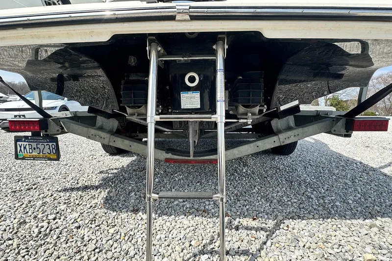 Slide: The Image of Rear view of a 2016 Yamaha 242 Limited S boat on a trailer with ladder. - 5