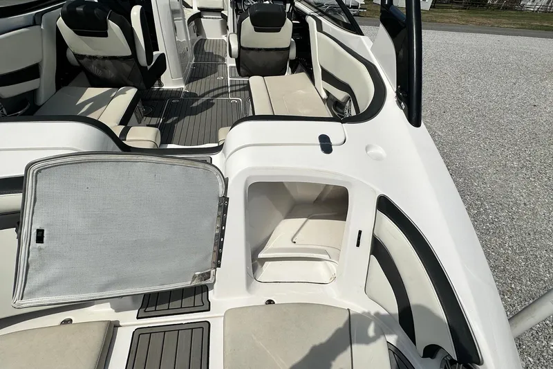Slide: The Image of 2016 Yamaha 242 Limited S boat interior with open storage compartment. - 9