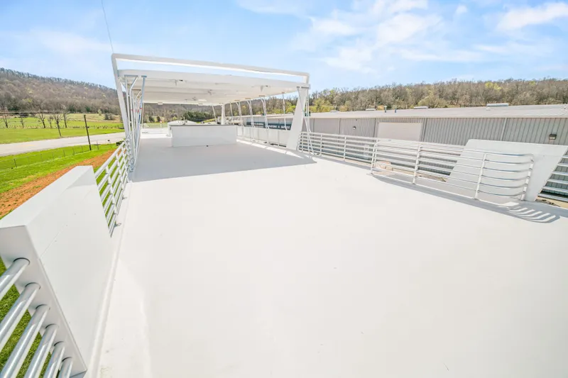 Slide: The Image of Rooftop deck of 2026 Sumerset Luxe III Show Boat under clear blue sky. - 22