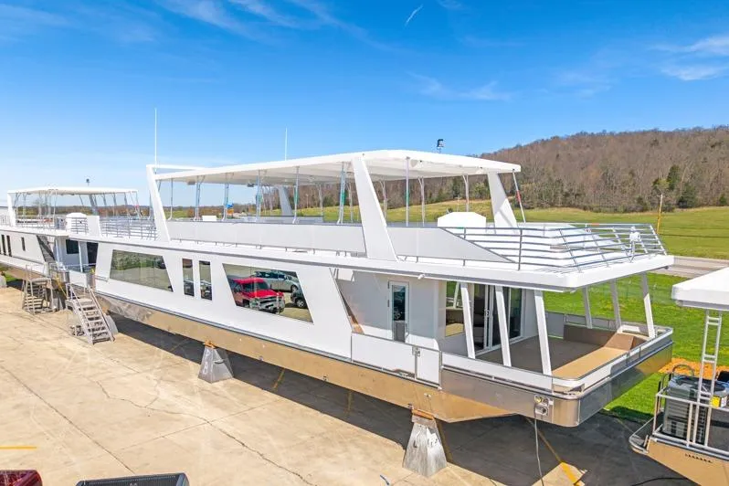 The Image of Luxurious 2026 Sumerset Luxe III Show Boat on display under clear blue skies. - 1