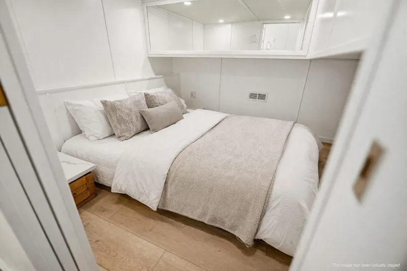 Slide: The Image of Luxurious bedroom interior on 2026 Sumerset Luxe III Show Boat, featuring elegant bedding and modern design. - 13