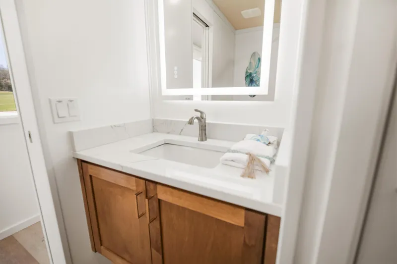 Slide: The Image of Modern bathroom vanity with illuminated mirror in 2026 Sumerset Luxe III Show Boat. - 15