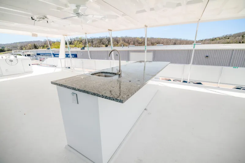 Slide: The Image of Rooftop kitchen area on 2026 Sumerset Luxe III Show Boat with granite countertop. - 21