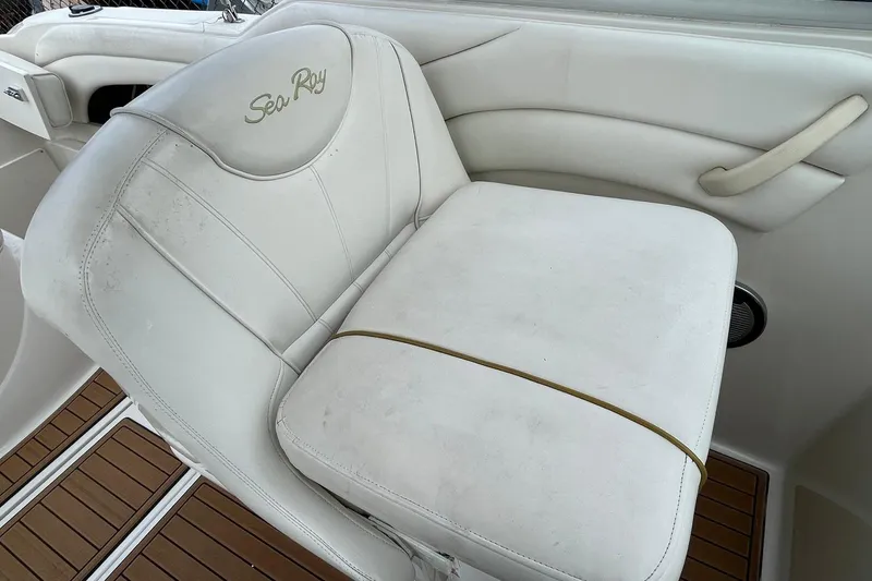 Slide: The Image of White leather seat on 2002 Sea Ray 225 Weekender boat, featuring elegant design and comfort. - 5