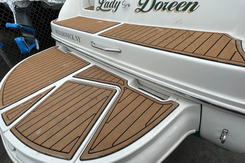 Slide: The Image of Rear view of 2002 Sea Ray 225 Weekender boat with teak-style decking. - 9