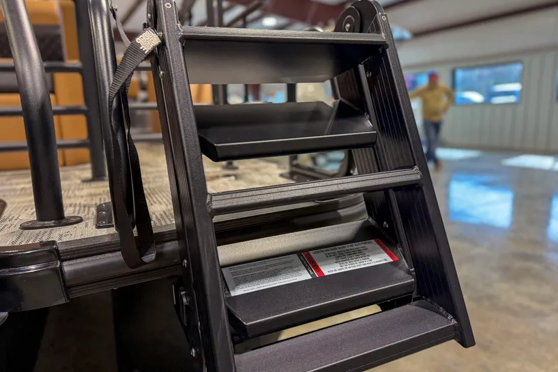 Slide: The Image of 2026 Sylvan L3 ULZ boat ladder detail in showroom setting. - 2