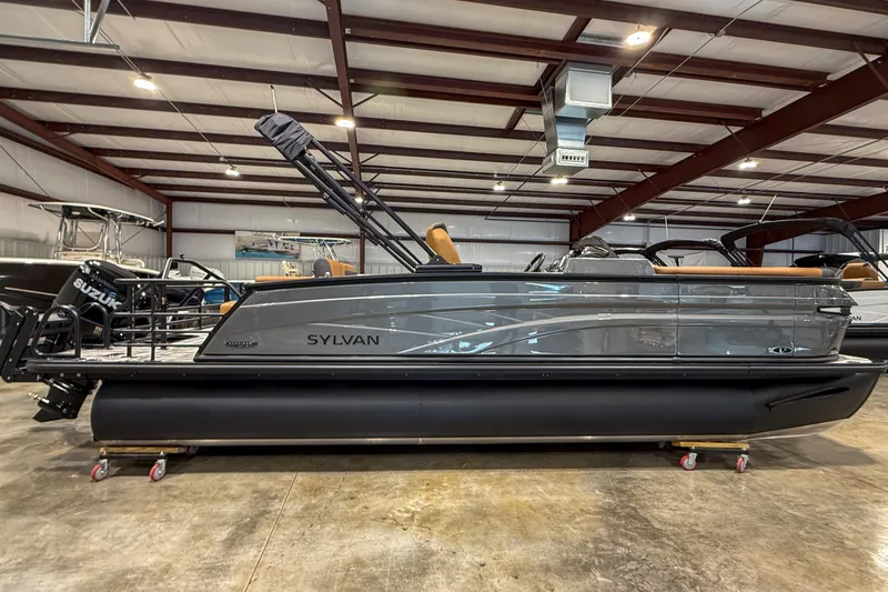Slide: The Image of 2026 Sylvan L3 ULZ pontoon boat in a showroom, featuring sleek design and Suzuki engine. - 3