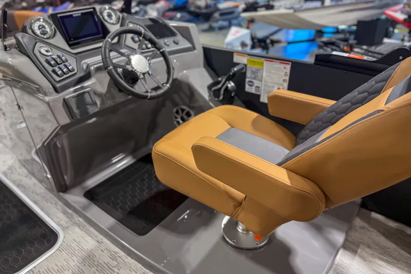 Slide: The Image of Captain's chair and dashboard of 2026 Sylvan L3 ULZ boat, featuring modern controls. - 9