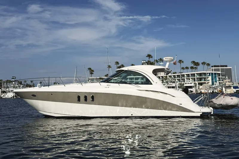 The Image of 2007 Cruisers Yachts 390 Express Coupe on water, marina background. - 1