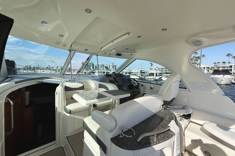 Slide: The Image of Luxurious interior of 2007 Cruisers Yachts 390 Express Coupe with marina view. - 12