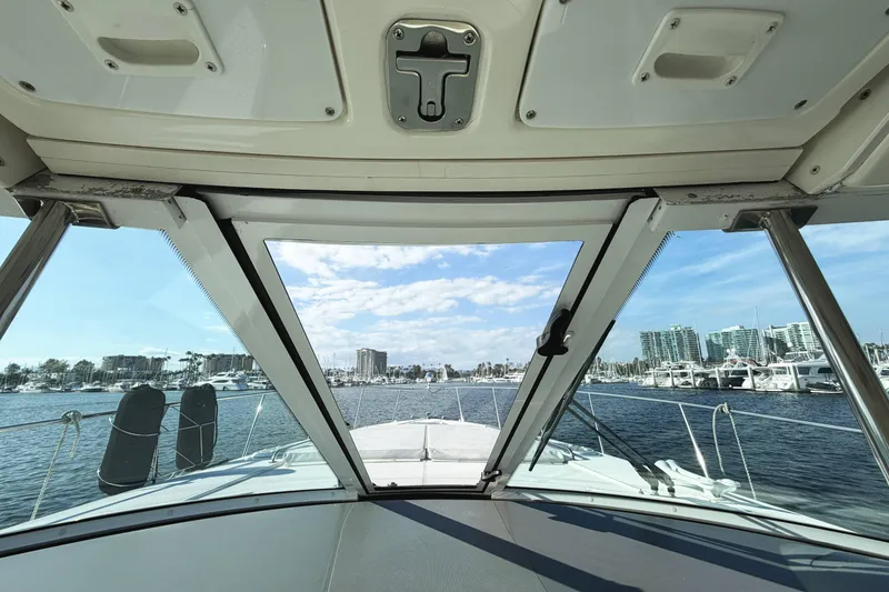 Slide: The Image of View from 2007 Cruisers Yachts 390 Express Coupe cockpit overlooking marina and skyline. - 13