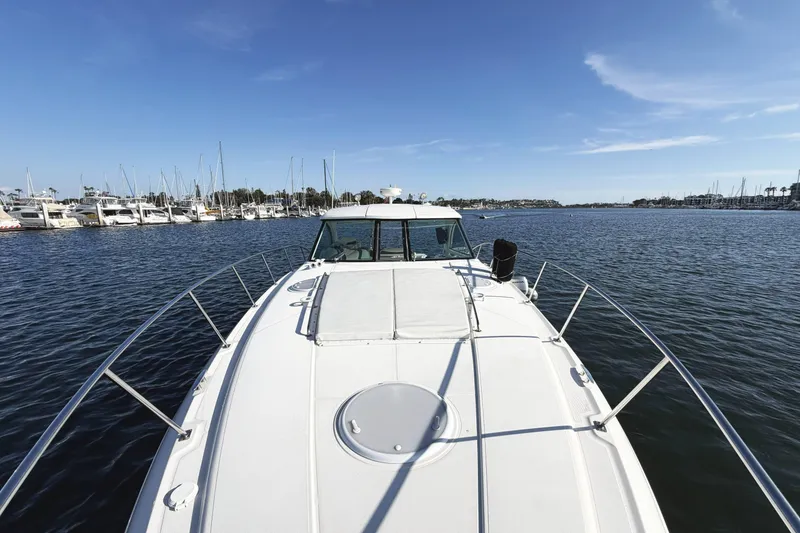 Slide: The Image of 2007 Cruisers Yachts 390 Express Coupe on calm waters, marina in background. - 14