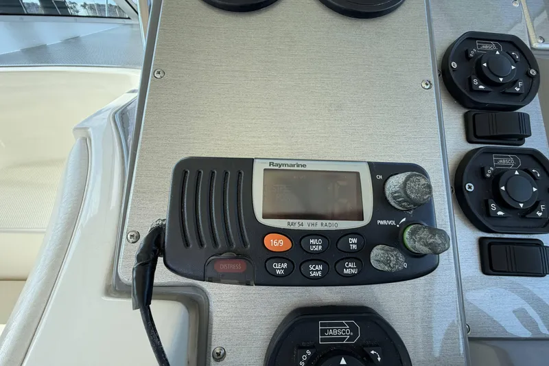 Slide: The Image of Control panel of a 2007 Cruisers Yachts 390 Express Coupe with Raymarine VHF radio. - 18