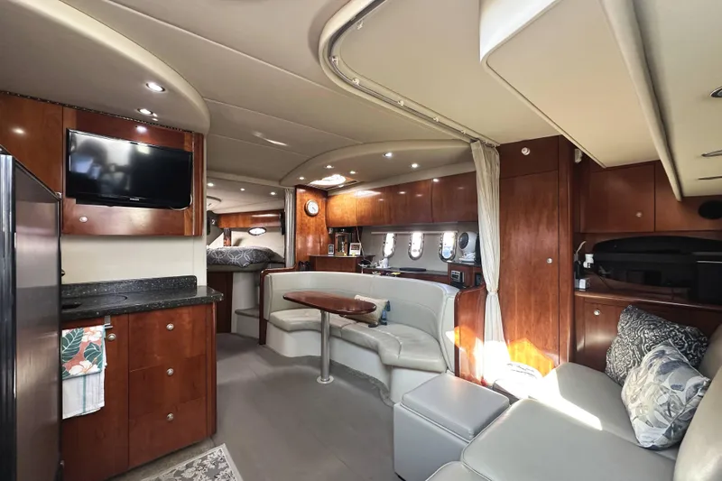 Slide: The Image of Luxurious interior of 2007 Cruisers Yachts 390 Express Coupe with elegant wood finishes. - 19