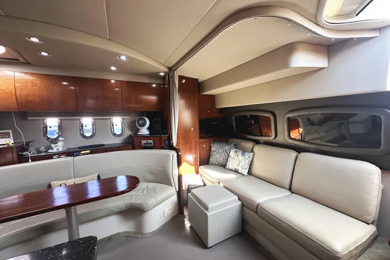 Slide: The Image of Luxurious interior of 2007 Cruisers Yachts 390 Express Coupe with elegant seating and wood finishes. - 22