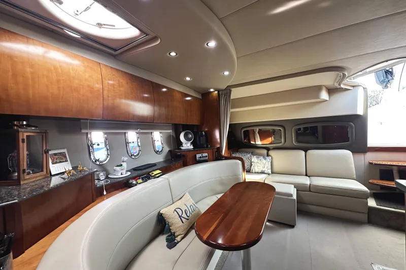 Slide: The Image of Luxurious interior of 2007 Cruisers Yachts 390 Express Coupe with elegant seating and wood finishes. - 24