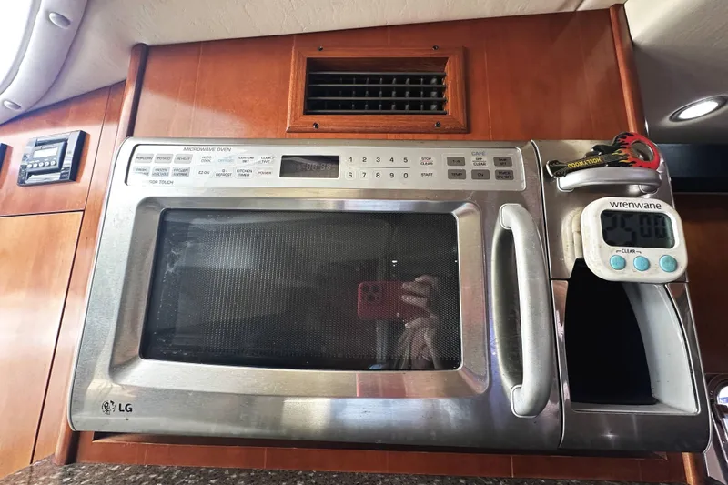 Slide: The Image of Microwave oven in 2007 Cruisers Yachts 390 Express Coupe kitchen interior. - 26