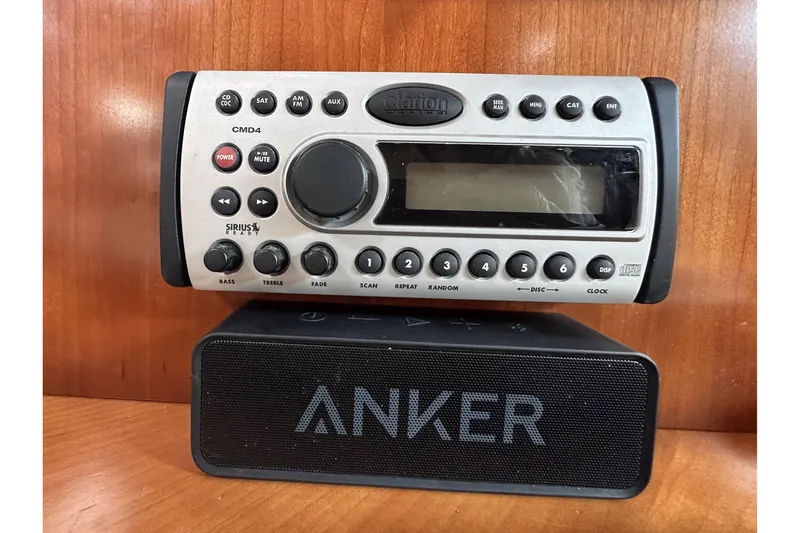 Slide: The Image of Clarion CMD4 stereo system and Anker speaker on a 2007 Cruisers Yachts 390 Express Coupe. - 27