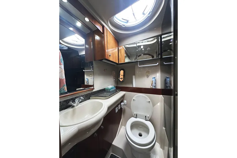 Slide: The Image of Luxurious bathroom in 2007 Cruisers Yachts 390 Express Coupe with modern fixtures and skylight. - 32