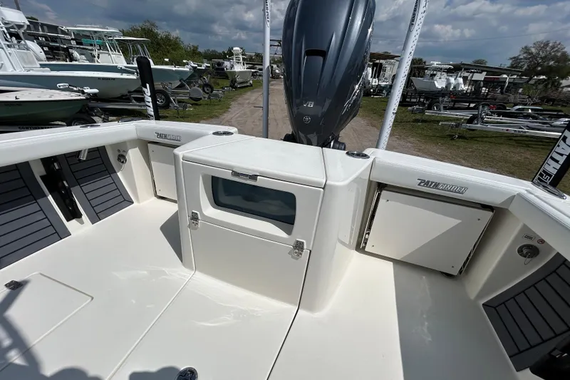 Slide: The Image of 2026 Pathfinder 2700 Open boat interior with storage compartments and powerful engine. - 11