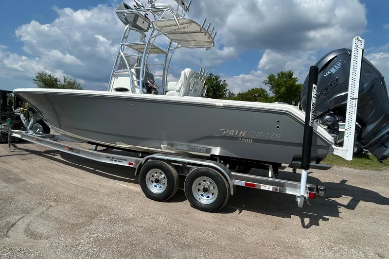 Slide: The Image of 2026 Pathfinder 2700 Open boat on trailer under cloudy sky. - 3