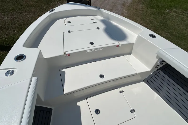 Slide: The Image of 2026 Pathfinder 2700 Open boat deck with storage compartments and seating. - 5