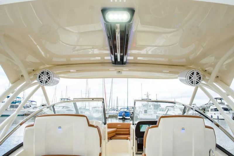 Slide: The Image of Manufacturer Provided Image: Interior view of 2025 Scout 255 Dorado boat with modern seating and dashboard. - 10