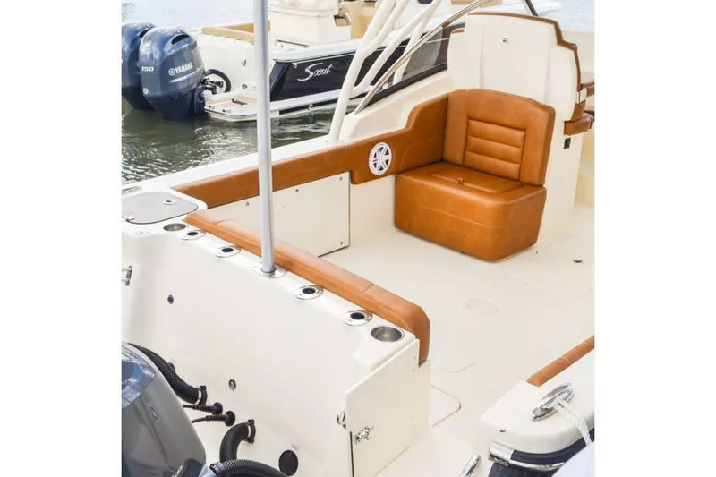 Slide: The Image of Manufacturer Provided Image: 2025 Scout 255 Dorado boat interior with tan leather seating and modern design. - 13