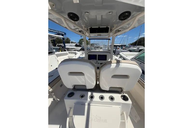Slide: The Image of 2021 Sea Chaser 30 HFC CC boat interior with helm and seating area. - 11