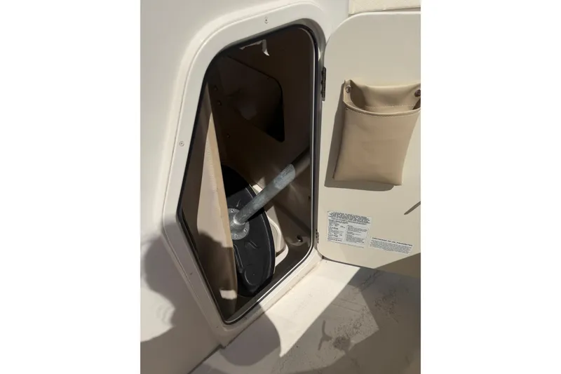 Slide: The Image of Storage compartment on a 2021 Sea Chaser 30 HFC CC boat, open with visible contents. - 15
