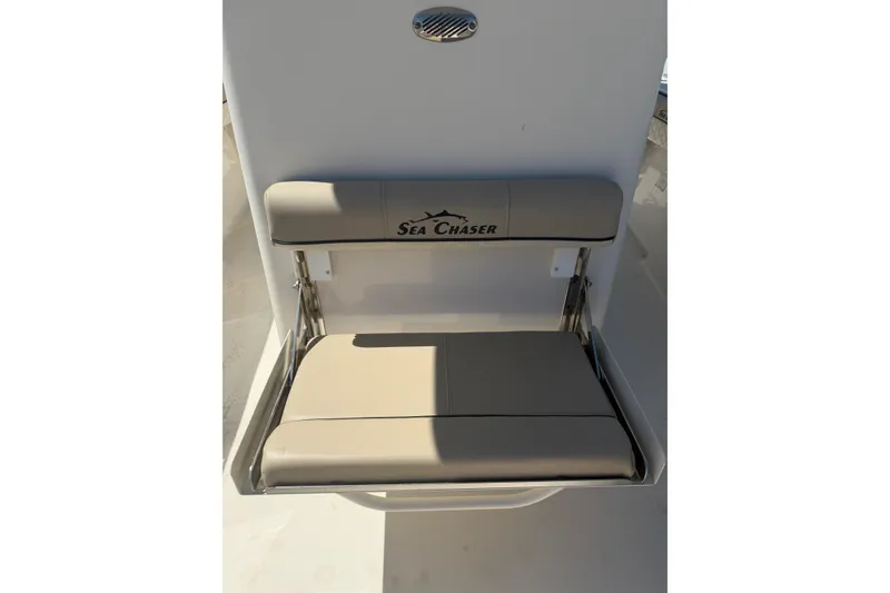 Slide: The Image of 2021 Sea Chaser 30 HFC CC boat seat with logo, beige upholstery. - 18