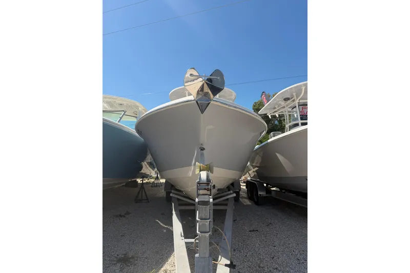 Slide: The Image of 2021 Sea Chaser 30 HFC CC boat on trailer under clear blue sky. - 2