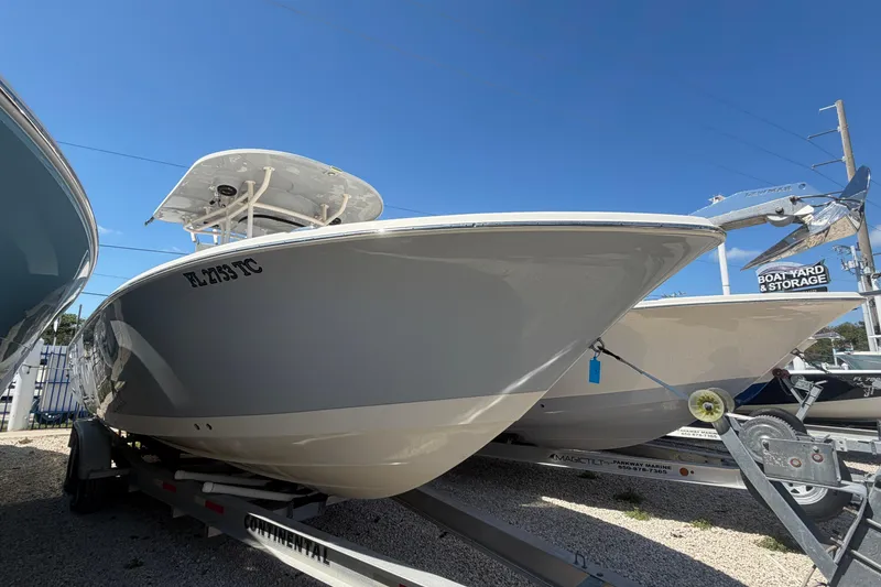 Slide: The Image of 2021 Sea Chaser 30 HFC CC boat on trailer under clear blue sky. - 3