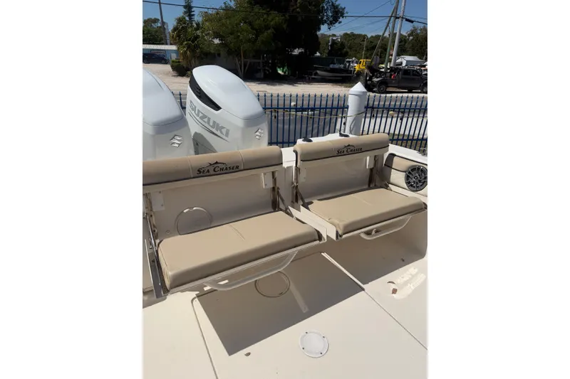 Slide: The Image of 2021 Sea Chaser 30 HFC CC boat with Suzuki engines and beige seating. - 7