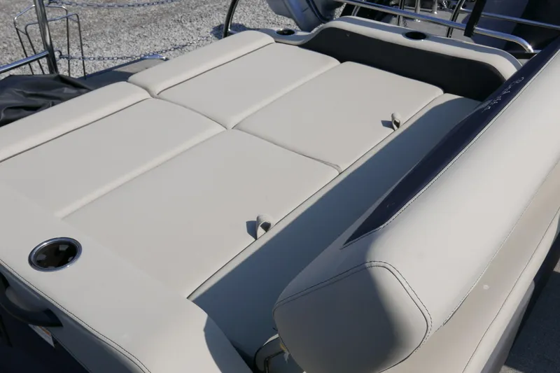 Slide: The Image of 2023 Barletta Cabrio 22UC boat with beige seating and cup holder. - 10