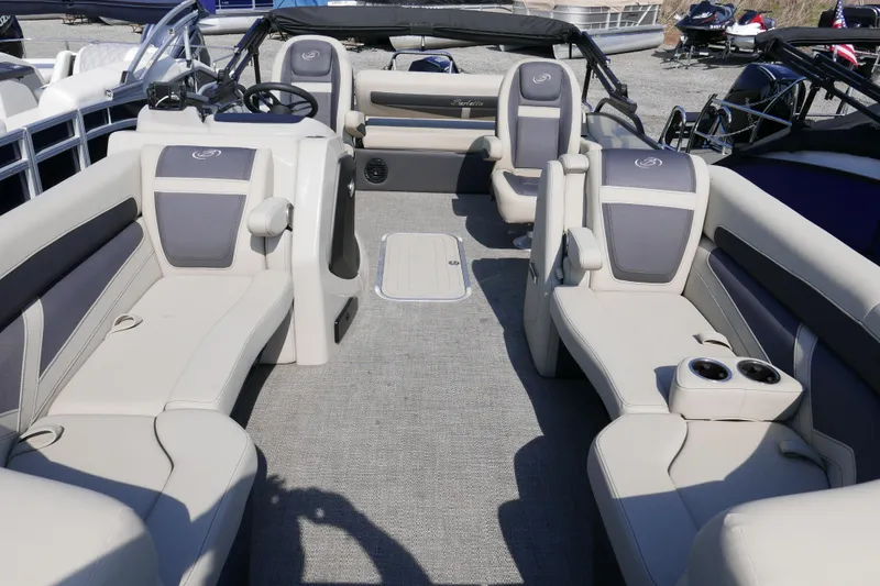 Slide: The Image of 2023 Barletta Cabrio 22UC pontoon boat interior with plush seating and modern design. - 3