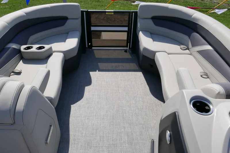 Slide: The Image of 2023 Barletta Cabrio 22UC pontoon boat interior with plush seating and cup holders. - 4