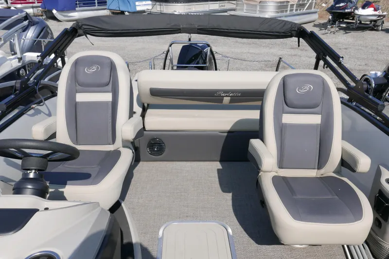 Slide: The Image of 2023 Barletta Cabrio 22UC boat interior with plush seating and modern design. - 7
