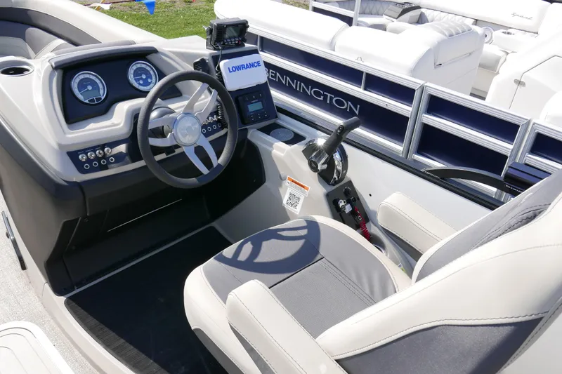 Slide: The Image of Interior of 2023 Barletta Cabrio 22UC boat with steering wheel and control panel. - 8