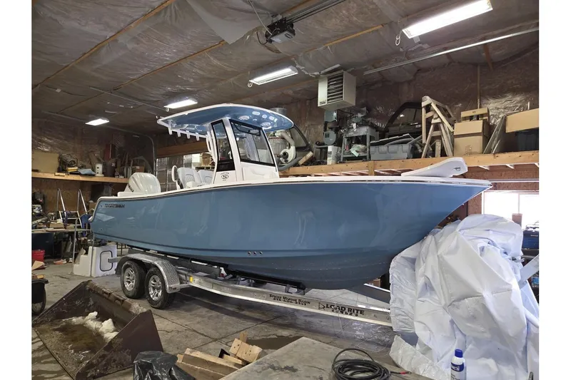 The Image of 2026 Sportsman Heritage 231 Center Console boat in a workshop setting. - 0