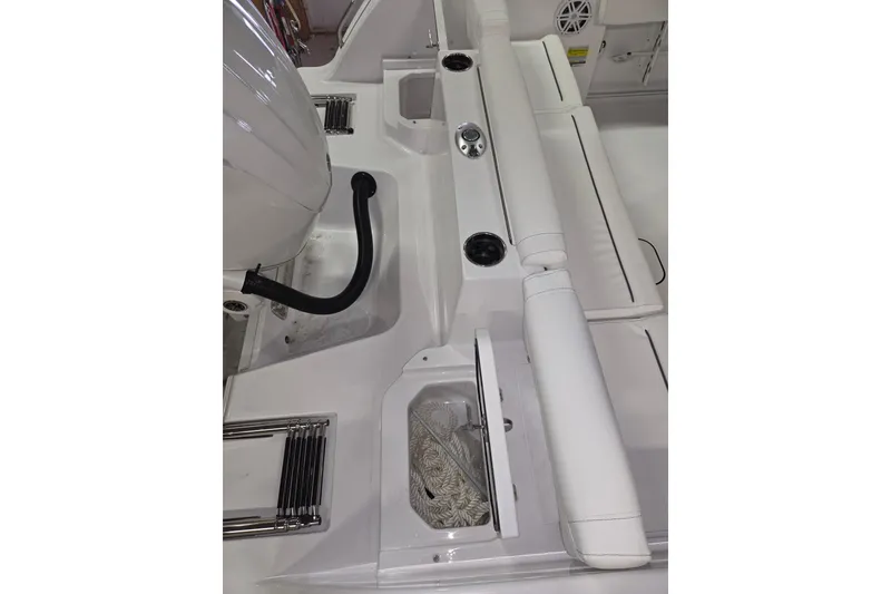 Slide: The Image of 2026 Sportsman Heritage 231 Center Console boat interior with seating and storage compartments. - 18