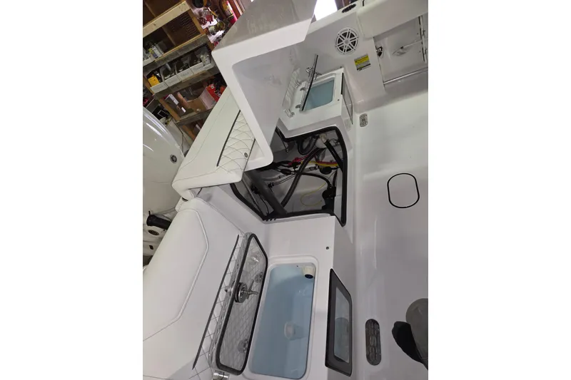 Slide: The Image of 2026 Sportsman Heritage 231 Center Console interior with storage compartments and seating. - 20