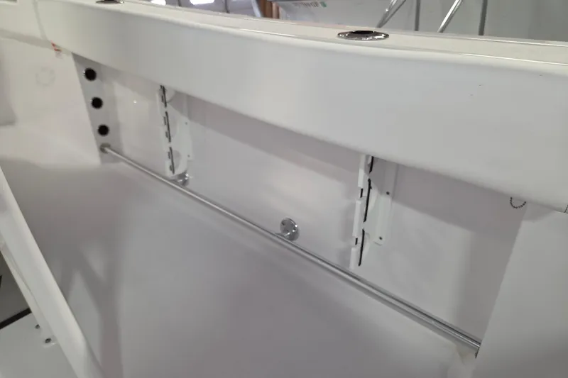 Slide: The Image of 2026 Sportsman Heritage 231 Center Console interior detail, showcasing sleek white design and fittings. - 4