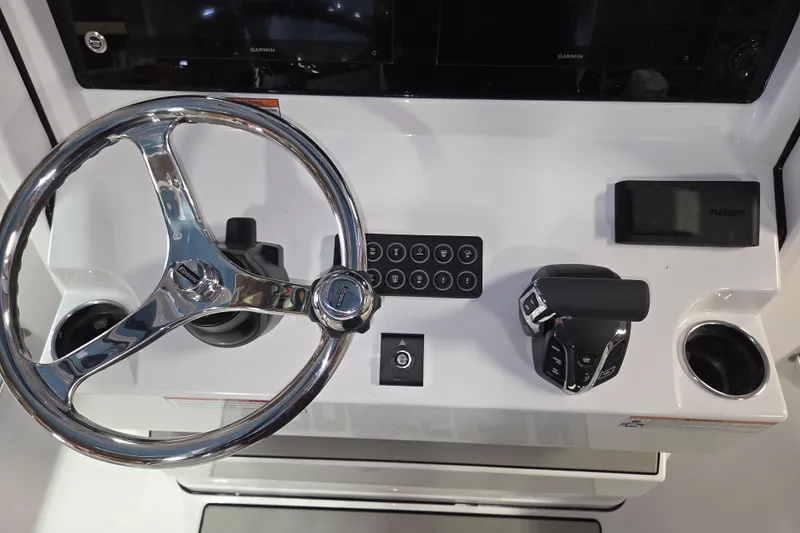 Slide: The Image of 2026 Sportsman Heritage 231 Center Console dashboard with steering wheel and controls. - 5