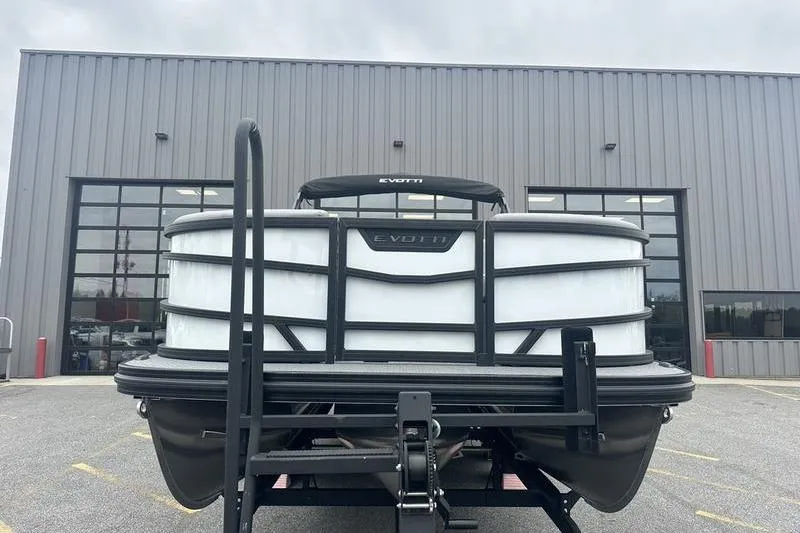 Slide: The Image of Front view of a 2026 Evotti 521QL boat on a trailer outside a warehouse. - 13