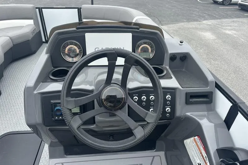 Slide: The Image of Cockpit of 2026 Evotti 521QL boat with steering wheel and dashboard controls. - 7